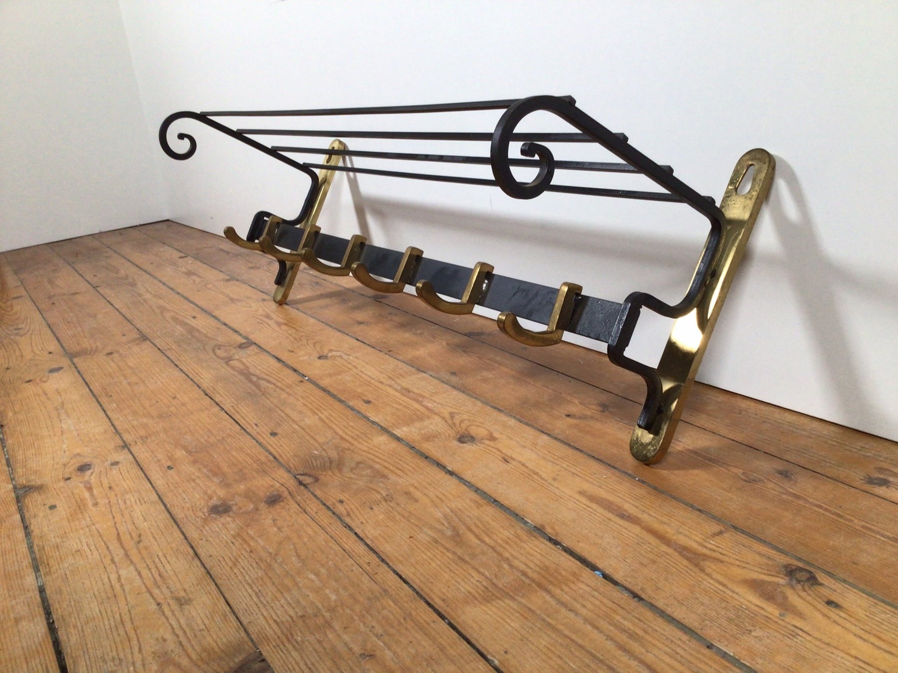 A heavy coat rack made of metal and brass Catawiki