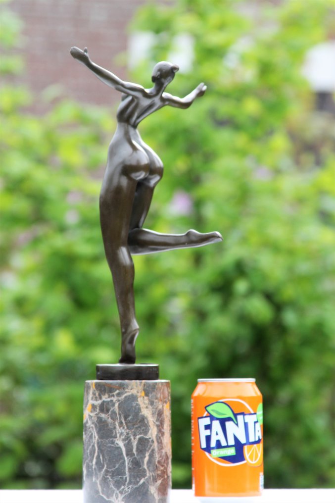 modern bronze sculpture of a cheerful lady, all bronze Catawiki