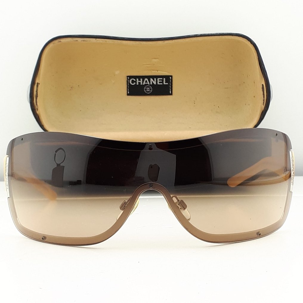 Chanel - Shield Brown Frame-Beige with Silver Tone Metal Chanel Plates -  Sunglasses - Catawiki