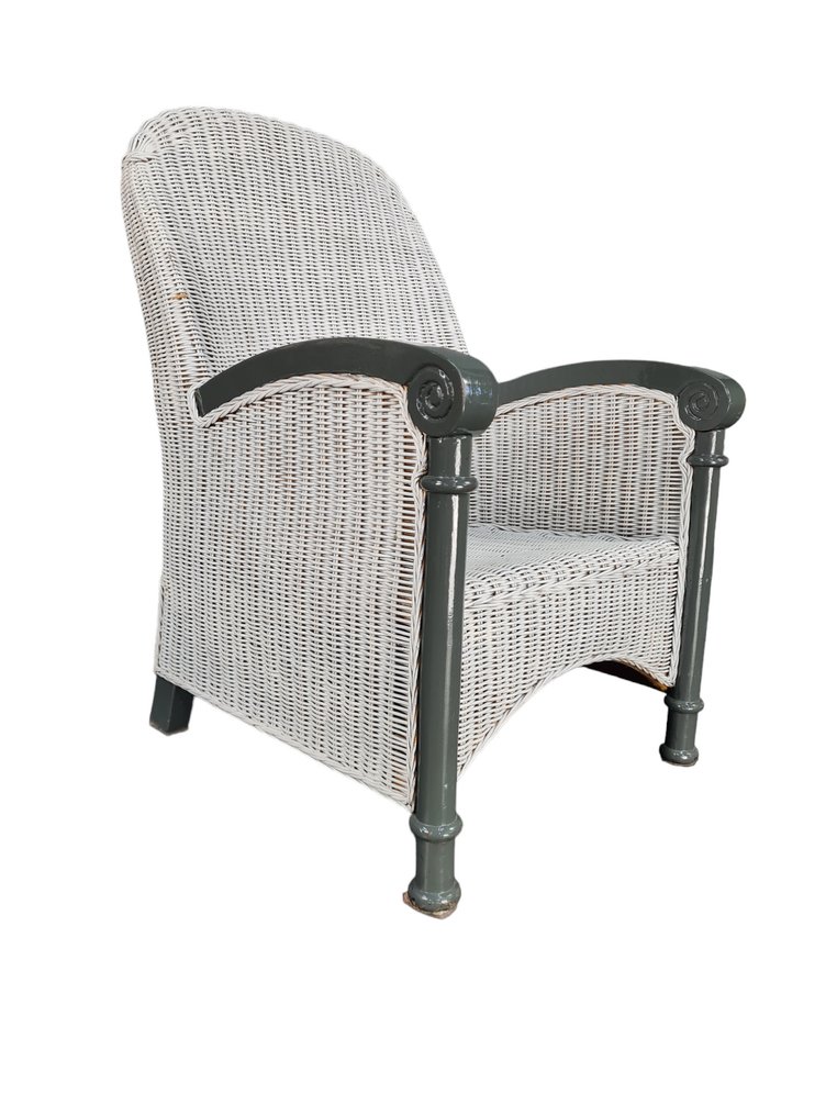 Fauteuil, A teak and wickerwork high end chair Catawiki