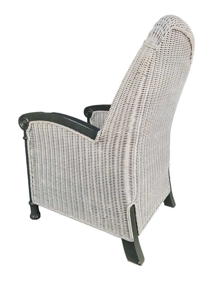 Fauteuil, A teak and wickerwork high end chair Catawiki