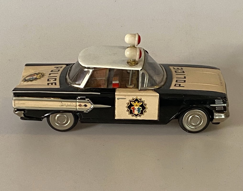 Ichiko Tin toy car Police Chevrolet Impala flywheel drive Catawiki