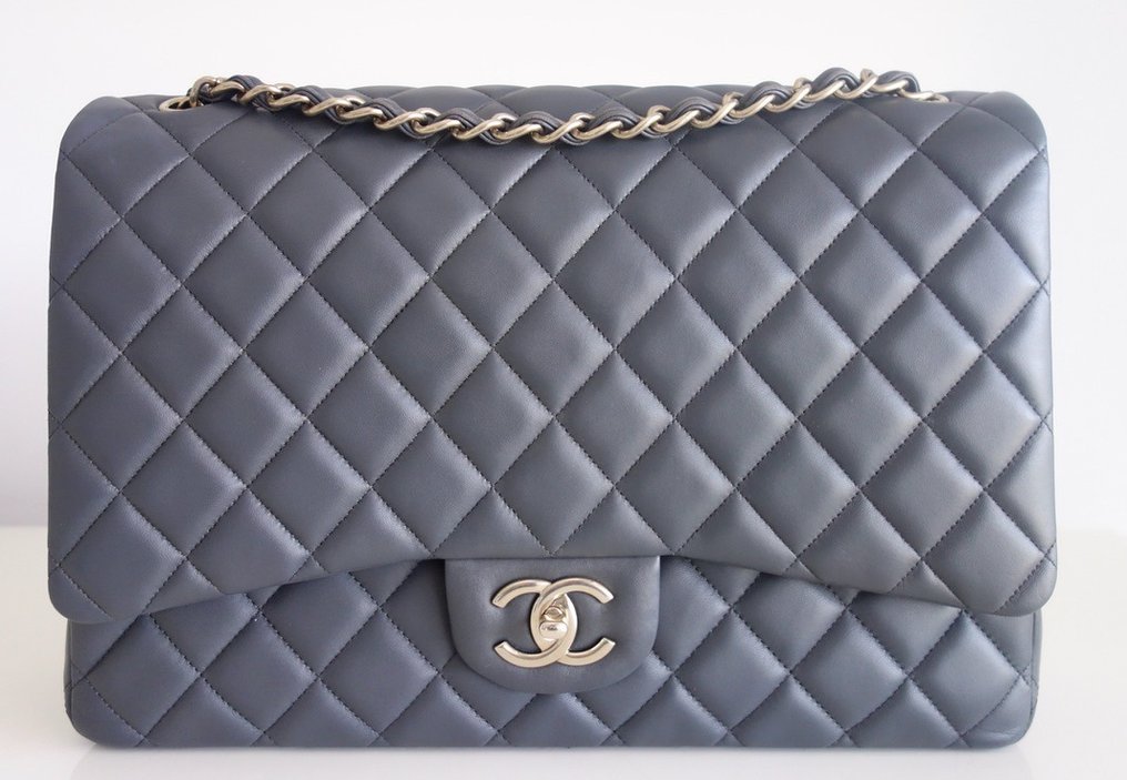 Sold at Auction: A Chanel 19 Maxi Grey Leather Flap Bag.