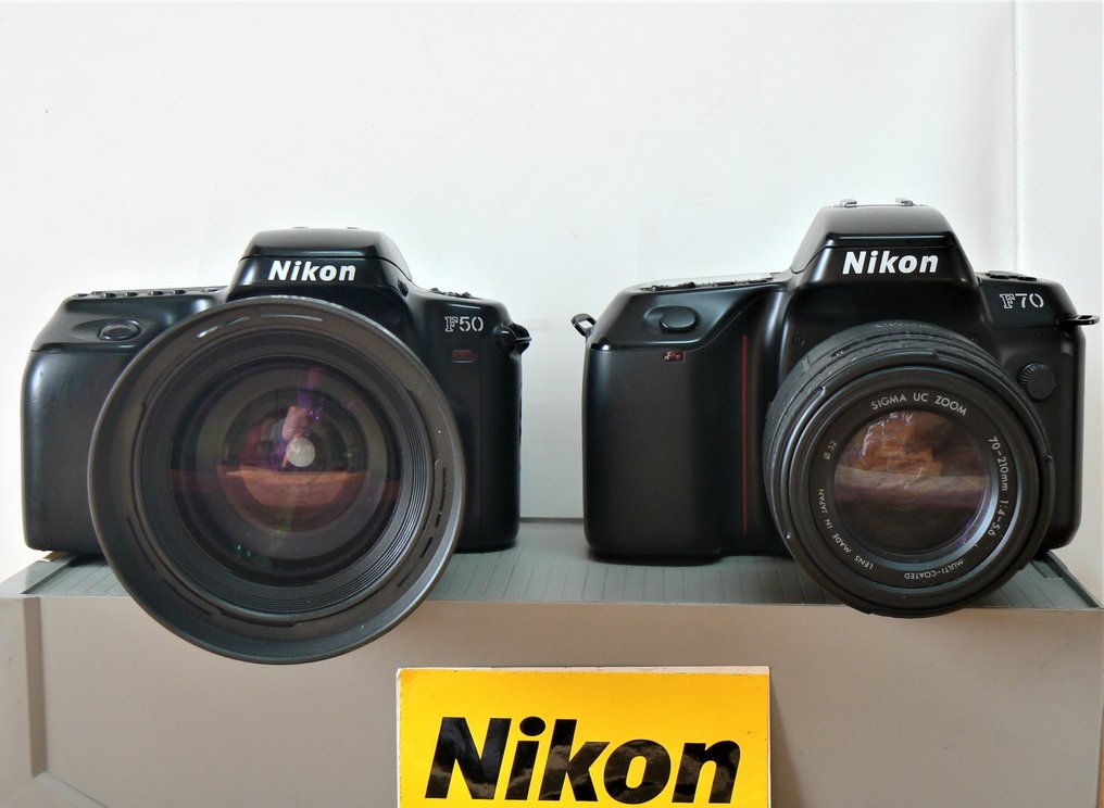 Nikon and F50 with lenses Tamron 28-200mm + Sigma -