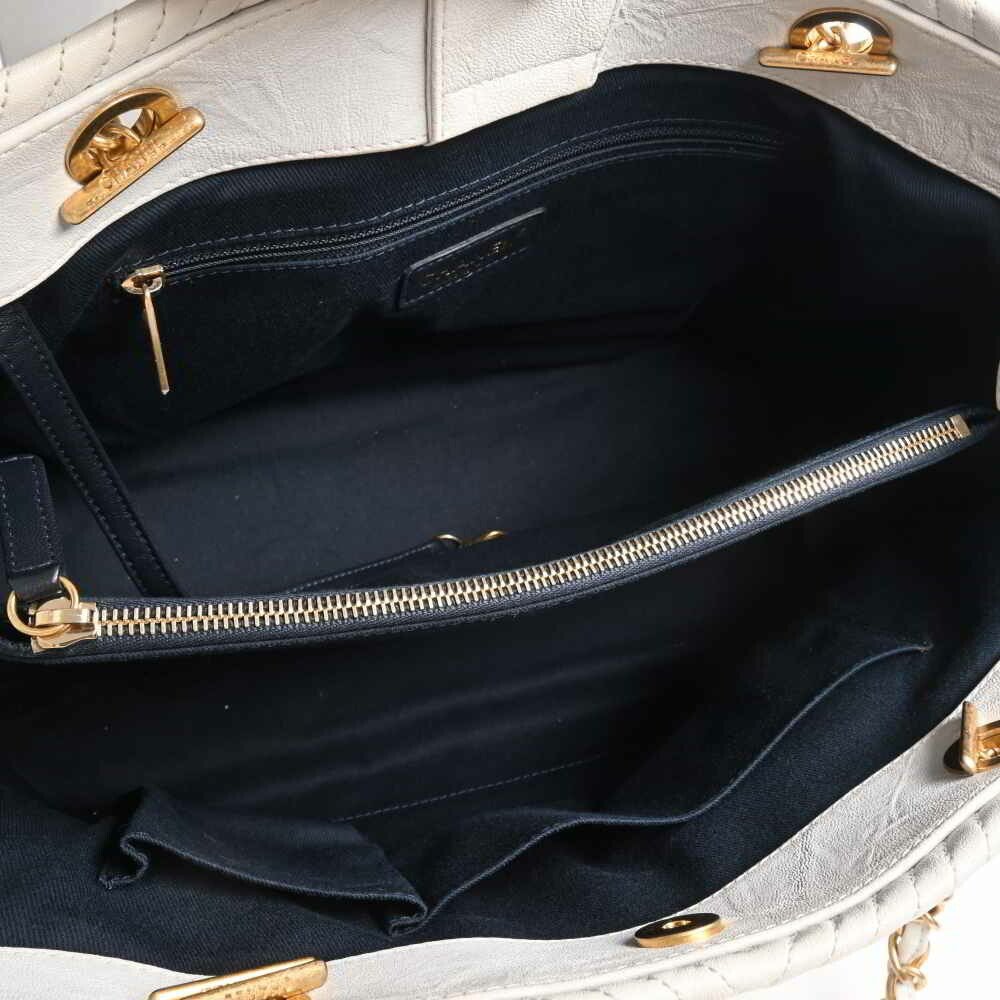 Sold at Auction: Chanel - a V-stitch flap shoulder bag in black